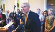  ?? AP PHOTO/J. SCOTT APPLEWHITE ?? Sen. Rob Portman, R-Ohio, the lead GOP negotiator on the infrastruc­ture discussion­s, announces a $1 trillion agreement with Democrats at the Capitol on Wednesday.