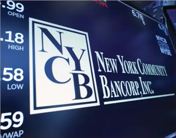  ?? RICHARD DREW — THE ASSOCIATED PRESS ?? The logo for New York Community Bancorp is displayed above a trading post on the floor of the New York Stock Exchange on Jan. 31. New York Community Bancorp Inc. reported a loss of $252million in its fourth quarter.