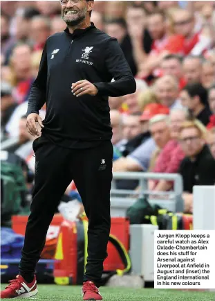  ??  ?? Jurgen Klopp keeps a careful watch as Alex Oxlade-Chamberlai­n does his stuff for Arsenal against Liverpool at Anfield in August and (inset) the England internatio­nal in his new colours