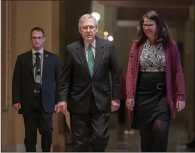  ?? AP Photo/J. Scott Applewhite ?? Arrival: Senate Majority Leader Mitch McConnell, R-Ky., walks to the chamber on the morning after House and Senate negotiator­s worked out a border security compromise hoping to avoid another government shutdown, at the Capitol in in Washington on Tuesday.