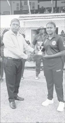  ?? ?? Player of the Match Ashmini Munisar receives her award from a GCB official.