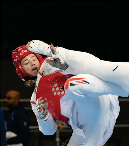  ?? ?? Rebecca McGowan, red, competes in the round of 16 against Lei Xu of China in the + 67kg category at the World GrandPrix Final in Manchester, where she picked up a silver medal, below left