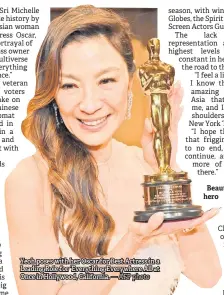  ?? — AFP photo ?? Yeoh poses with her Oscar for Best Actress in a Leading Role for ‘Everything Everywhere All at Once in Hollywood, California.