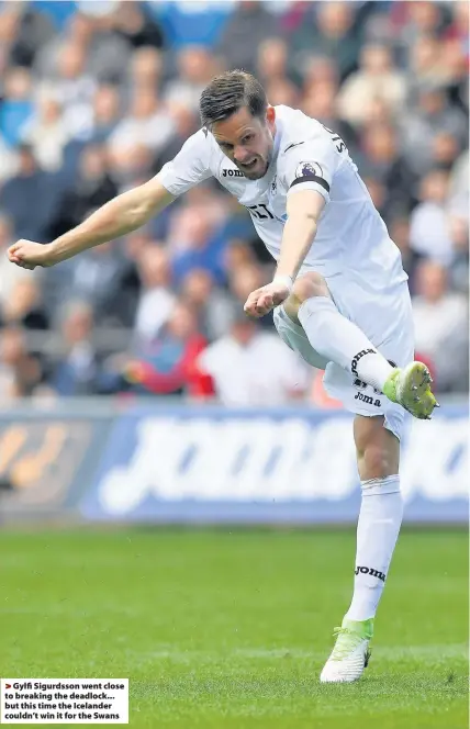  ??  ?? > Gylfi Sigurdsson went close to breaking the deadlock... but this time the Icelander couldn’t win it for the Swans