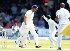  ??  ?? On his way: a dejected Alastair Cook departs for three