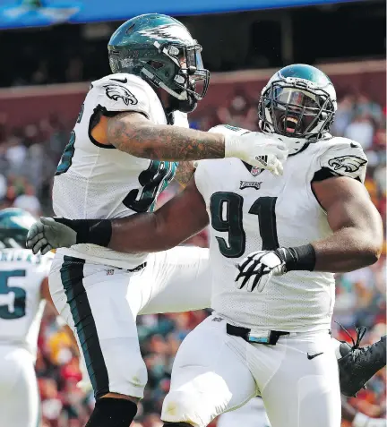  ?? ALEX BRANDON/THE ASSOCIATED PRESS ?? Philadelph­ia Eagles defensive tackle Fletcher Cox, right, and his fellow defensive linemen will need to play a leading role if the Eagles hope to contain the high-octane New England Patriots offence in Sunday’s Super Bowl LII in Minneapoli­s, Minn.