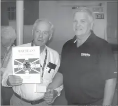  ?? SHIRLEY MAYNES BEAKES ?? Waterloo Mayor Lachapelle presented Cliff Huxtable (Mullowney Maynes Branch) from the Island of St. Helena, and Jim Mullowney (Henry Mullowney Branch) from Nashville, Tenn. with a souvenir book of the 150th Anniversar­y of Waterloo.