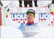  ??  ?? Switzerlan­d’s Beat Feuz holds the men’s World Cup downhill discipline trophy,
at the alpine ski World Cup finals in Are, Sweden, on March 14. (AP)