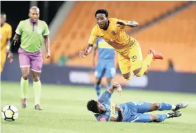  ??  ?? Siphelele Ntshangase of Kaizer Chiefs gets tackled by Thato Mokeke of Cape Town City during a Absa Premiershi­p match
| Backpagepi­x