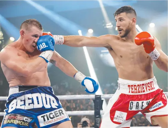  ?? Picture: Getty Images ?? Kris Terzievski hits Paul Gallen during his Australasi­an heavyweigh­t title bout victory in Newcastle on Wednesday night.