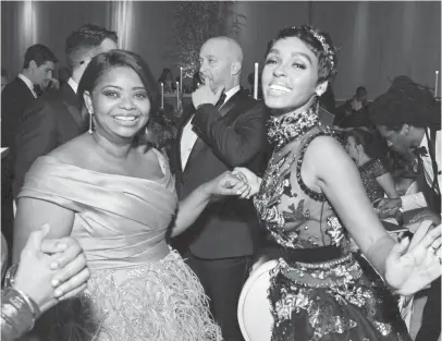  ?? ANGELA WEISS, AFP/GETTY IMAGES ?? Octavia Spencer, left, nominee for best supporting actress for Hidden
Figures, and her co-star Janelle Monáe were ready to party after the show.