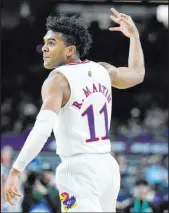  ?? Brynn Anderson The Associated Press ?? Kansas guard Remy Martin celebrates after hitting a 3-pointer against Villanova in Saturday’s national semifinal game.