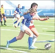  ?? Courtney Couey, Ringgold Tiger Shots ?? Ringgold’s Drew Burke jockeys for possession of the ball during the Lady Tigers’ Class AAA state playoff match with visiting Stephens County last Tuesday night.