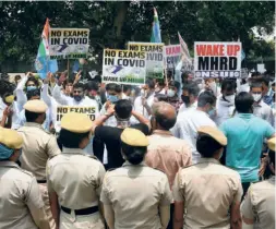  ??  ?? OUTSIDE THE MINISTRY of Human Resource Developmen­t in New Delhi on July 2, supporters of the National Students’ Union of India demanding the cancellati­on of final year examinatio­ns.