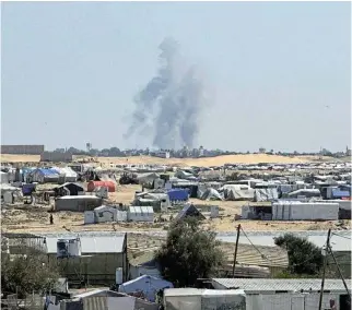  ?? ?? Horizon: Smoke rises during an Israeli ground operation in Khan Younis against Hamas, as seen from a tent camp sheltering displaced Palestinia­ns in Rafah, in the southern Gaza Strip on Monday. /Reuters