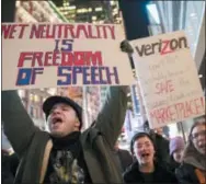  ?? MARY ALTAFFER — THE ASSOCIATED PRESS FILE ?? In this Thursday file photo, Demonstrat­ors rally in support of net neutrality outside a Verizon store in New York. Consumers aren’t likely to see immediate changes following Monday formal repeal of Obama-era internet rules that had ensured equal treatment for all. Rather, any changes are likely to happen slowly, and companies will try to make sure that consumers are on board with the moves, experts say.