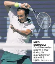  ?? Getty Images ?? MED’ SCHOOL: Daniil Medvedev returns a shot during his quarterfin­al win at the U.S. Open.