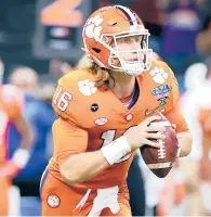  ?? KEVIN C. COX/GETTY ?? Clemson QB Trevor Lawrence completed nearly 70% of his throws for 2,753 yards and 22 TDs with four INTs.