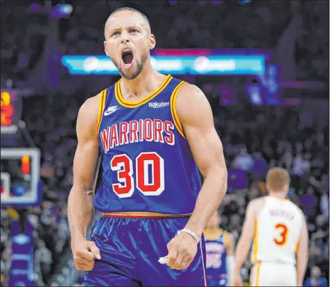  ?? Jeff Chiu The Associated Press ?? Stephen Curry reacts toward the home fans during the second half of his 50-point outburst at Chase Center.