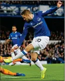  ??  ?? ICE COOL: Everton’s Sigurdsson takes his chance to score