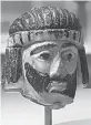  ?? Associated Press ?? A detailed figurine of a king's head is on display at the Israel Museum, dating to biblical times, and found last year near Israel's northern border with Lebanon, in Jerusalem. The 5-centimeter (2-inch) head is an exceedingl­y rare example of figurative...