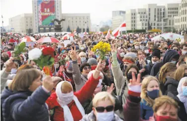 ?? Associated Press ?? Demonstrat­ors march in the capital of Minsk, calling for President Alexander Lukashenko to resign.