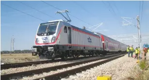  ?? (Sybil Ehrlich) ?? AN ELECTRIC LOCOMOTIVE hauling double-decker coaches is seen near Latrun yesterday, as preparatio­ns continue for the high-speed Tel Aviv-Jerusalem railway line due to begin operation in two-and-a-half months.