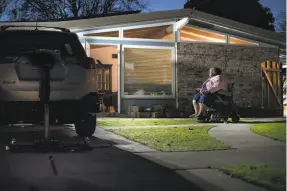  ??  ?? Johnson, 62, who uses an electric wheelchair, heads into the house in Hayward where she has lived since she was 4. Season of Sharing helped her keep her home.