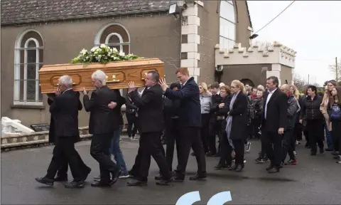  ??  ?? The funeral procession arrives at Kilmore Church.