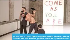  ?? — AP photos ?? In this Sept 5 photo, Syrian migrants Medhat Aldaabal, Moufak Aldoabl and Amr Karkout, practice ahead of a performanc­e of “Come As You Are” in Berlin.