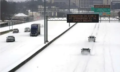  ??  ?? Drivers navigate snow-laden highways following record sub-zero temperatur­es across the US this February Photograph: Rogelio V Solis/ AP