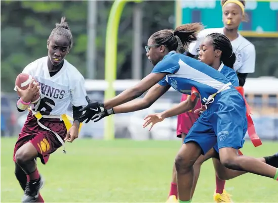  ?? PHOTOS BY GARY CURRERI ?? Above, Vikings player Jayla Palmer avoids the flag pull of Panthers defender Jada Eggelletio­n during the Broward County middle school girls’ flag football championsh­ip game at Nova High School. The Vikings won, 14-6. Below left, Dillard Middle School...