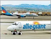  ?? DAVID BECKER/AP 2013 ?? Shares of Allegiant Air’s parent company fell 3 percent Monday after a “60 Minutes” report on safety concerns.