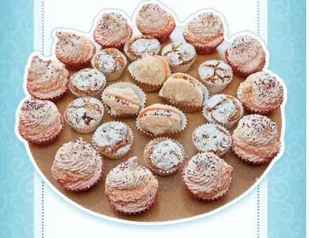  ?? MICHAEL SEARS, MILWAUKEE JOURNAL SENTINEL ?? Above: A tray of traditiona­l Mimouna sweets includes coconut macaroons (cupcake shape), filled almond cookies (clam shell shape), and peanut cookies.