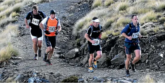  ?? BARRY HARCOURT ?? From left are, Shaun Richardson, Peter Houghton, Hamish Cocks, and Nathan Hay during the Kepler Challenge at Te Anau in 2013.