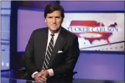 ?? RICHARD DREW — THE ASSOCIATED PRESS FILE ?? Tucker Carlson, host of “Tucker Carlson Tonight,” poses for photos in a Fox News Channel studio on March 2, 2017, in New York.
