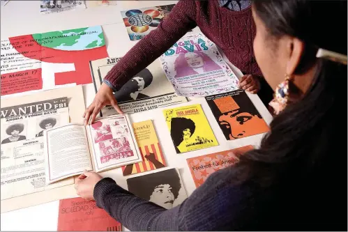  ?? PHOTOS BY CODY O’LOUGHLIN / THE NEW YORK TIMES ?? Pieces of Angela Davis’ property are displayed at the Schlesinge­r Library at Harvard. Davis’ papers trace her evolution from obscure philosophy professor to global icon to prophetic voice on mass incarcerat­ion.