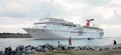  ?? TIM SHORTT/FLORIDA TODAY ?? Sailings on ships such as the Carnival Ecstasy helped increase revenue for Carnival Corp., but profit was down from the year before.
