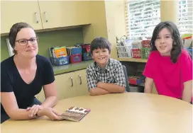  ??  ?? Grade 3 teacher Amber Holman, with students Marcus Stevenson and Ella Gatrell at Margaret Jenkins Elementary.
