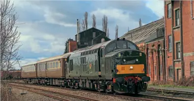  ?? CHRIS GEE ?? Locomotive Services Limited will provide ‘Tractors’ to haul the ‘Three Peaks from a Seat 2021’ charter. Class 37
No. D6851 paid a brief visit to Yorkshire on March 15 to collect HST trailer cars for the operator’s expanding fleet. It returned to Crewe the following day, when it was photograph­ed passing the old maltings at Milford Junction, close to its destinatio­n at Gascoigne Wood.