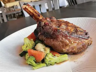  ?? Mike Sutter / Staff photo ?? A veal chop with sauteed vegetables at Aldo’s Ristorante Italiano is a salute to savory goodness.