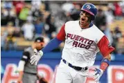  ?? Jayne Kamin-Oncea / Getty Images ?? Puerto Rico’s Carlos Correa rounds the bases after his two-run homer Monday against the Netherland­s.