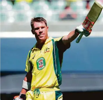  ?? AFP ?? Australia’s David Warner acknowledg­es the crowd after scoring his century during the fifth and final ODI against Pakistan at the Adelaide Oval yesterday.