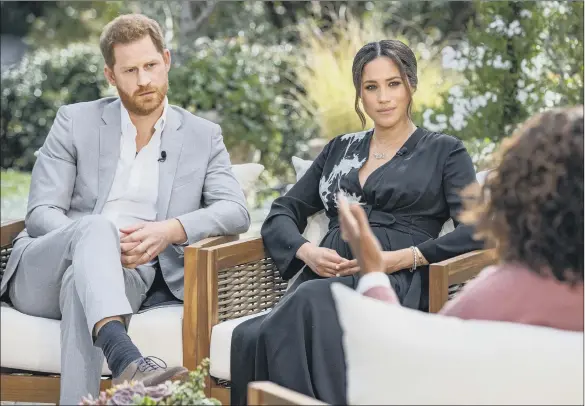  ?? PICTURE: JOE PUGLIESE/HARPO PRODUCTION­S/PA. ?? SETPIECE EVENT: The Duke and Duchess of Sussex during their interview with Oprah Winfrey, which will be shown on ITV on Monday after being broadcast in the US tomorrow.