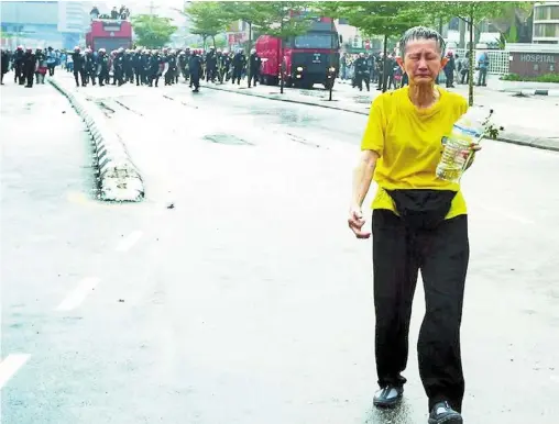  ?? ?? Icon of democracy: Ooi became an instant hero with thousands who took part in several rallies and gatherings in Kuala Lumpur back then for her defiant walk forward despite being sprayed with teargas and water cannons during Bersih 2.0