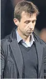  ??  ?? Dark Blues boss Neil McCann heads for the dressing room after watching his side suffer a third straight league defeat.