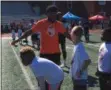  ?? JEFF SCHUDEL — THE NEWS-HERALD ?? Jarvis Landry talks with campers June 14 at Shaker Heights High School.