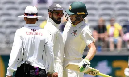  ??  ?? Captains Virat Kohli and Tim Paine react during play on day four of the second Test between Australia and India. Photograph: STRINGER/ Reuters