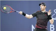  ?? TOM DULAT/GETTY IMAGES ?? Andy Murray plays a forehand during his exhibition match against Roberto Bautista Agut in Abu Dhabi on Friday.