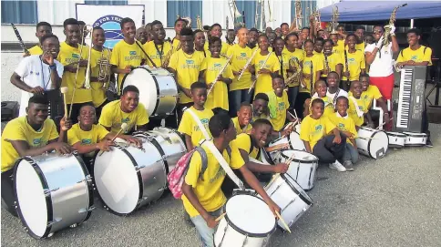  ?? CONTRIBUTE­D ?? Students of the Food For The Poor’s Summer Band Camp react after hearing the news that the instrument­s they used during the camp now belonged to them as a gift for their participat­ion and dedication.